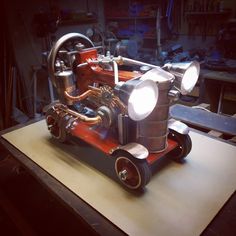 an old fashioned car engine on a workbench