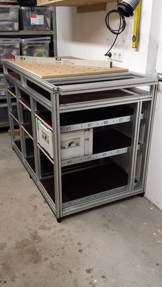 a large metal shelf with several drawers in it