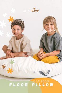 two children sitting on a floor pillow in front of a white background with the words, kids room floor pillow