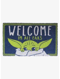 a door mat with the words welcome i'm all ears and an image of yoda