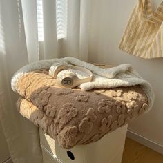 a hair dryer sitting on top of a towel rack