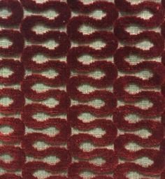 closeup of red fabric with circles on the top and bottom, as if it were crocheted