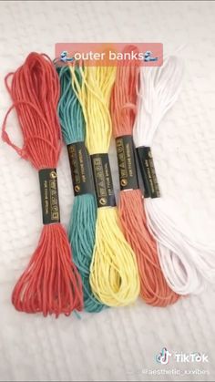 four different colored cotton cords on a white surface with the words outer banks above them