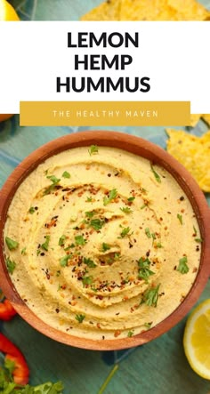 a bowl filled with hummus and topped with cilantro