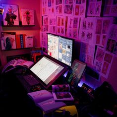 a laptop computer sitting on top of a desk in front of a monitor and keyboard