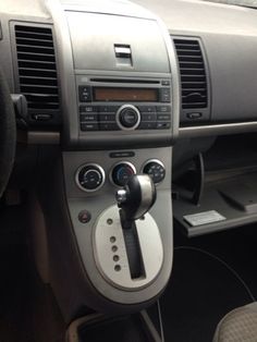 the interior of a car with buttons and controls