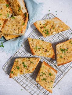 several pieces of bread sitting on top of a cooling rack