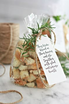 a small bag filled with crackers next to a tag that says giving thanks on it