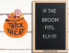 a sign that says if the broom fits fly it next to an image of a trick and treat