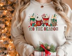 Christmas Coffee Shirt,Tis The Season Christmas Sweatshirt, Peppermint Iced Latte Snowmen Sweets Snow Warm Cozy Winter Women Shirt, Christmas Latte Shirt * High quality and super soft, comfortable shirt. Made with top-of-the-line vinyl and pressed with a professional grade heat press. * Please check all color and size charts before place the order. Since all shirts are custom made based on your selection, I don't accept return or exchange unless there is an issue with your order. *We're working Christmas And Coffee, Holiday Sweatshirt, Mom Coffee, Coffee Shirts, Comfy Sweatshirt, Gift For Christmas, Coffee Lover Gifts