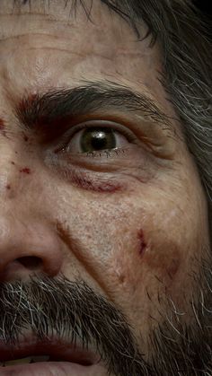 a close up of a man's face with blood all over his forehead and eyes