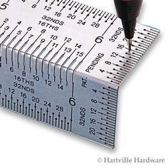 a ruler with a needle on top of it