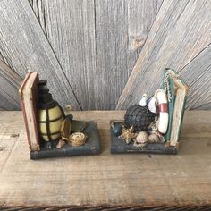 two bookends with books and other items on them