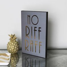 a pineapple sits next to a sign that says no riff raff