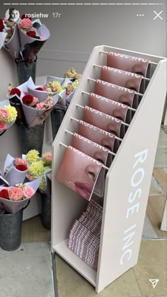 a display case filled with lots of different types of flowers