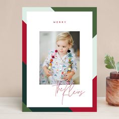 a christmas card with the words merry on it and an image of a young boy