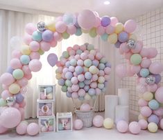 the balloons are all over the room and it looks like they have been decorated for a baby's first birthday