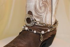 I repurpose vintage and vintage inspired jewelry into these beautiful boot bracelet jewelry pieces. Each piece is as unique as the pieces of vintage and estate jewelry that I purchase.   Multi strand boot bracelets for any occasion and will fit most boots as shown.  Wedding party orders can also be done. Boot Decor, Boot Chains, Boot Bracelet, Lapis Jewelry, Boot Bling, Floral Boots, Biker Jewelry, Vintage Inspired Jewelry, Boot Jewelry