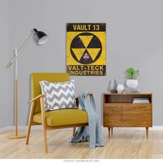 a yellow chair sitting in front of a wall with a sign on it that says vault 13