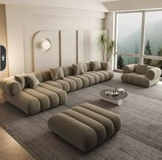 a modern living room with large sectional sofas