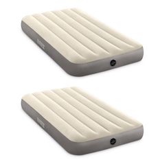 two inflatable mattresses sitting next to each other on a white background,