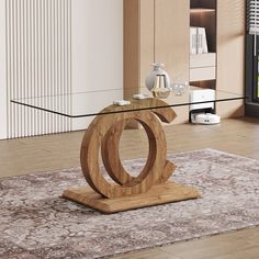 a glass table with a wooden base in the middle of a living room, next to a rug