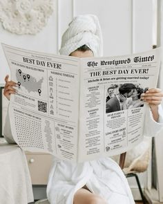 a woman sitting in a chair while reading a newspaper with her head wrapped around the neck