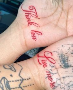 two people with matching tattoos on their hands