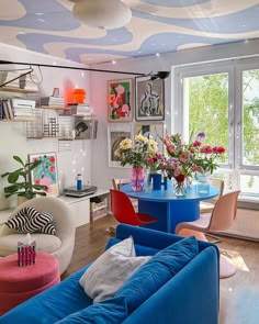 a living room filled with furniture and colorful decor