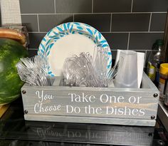 a wooden sign that says you take one or choose do the dishes with silverware in it