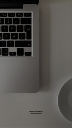 an apple laptop computer sitting on top of a desk next to a mouse and keyboard