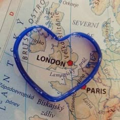 a heart shaped object sitting on top of a map with the word london in it