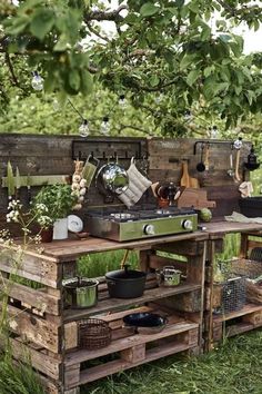 an outdoor kitchen made out of wooden pallets