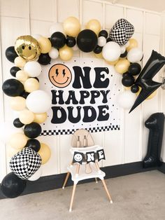 a black and white one happy dude balloon arch for a birthday party or baby shower