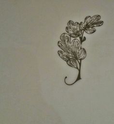 a drawing of some flowers on a white surface