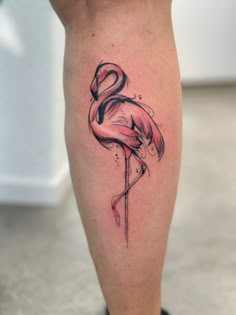 a flamingo tattoo on the leg