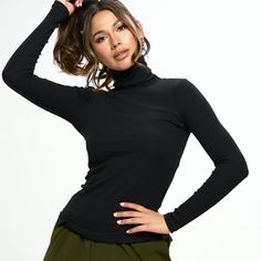 Looking for the perfect layering piece this winter? Look no further! - A long sleeve turtleneck top in a ribbed cotton knit fabrication - Form-fitting silhouette - Hip length - Fabric: 95%COTTON/5%SPANDEX *Model is 5ft 8" and wears a size S *Model measurements: Bust 32", Waist 24", Hips 34" *due to screens / filters colors may vary slightly to photos* Cotton Turtleneck, Turtle Neck Sweater, Photo Processing, Turtleneck Top, Ribbed Turtleneck, Long Sleeve Turtleneck, Turtle Neck Top, Black Rib, Winter Looks