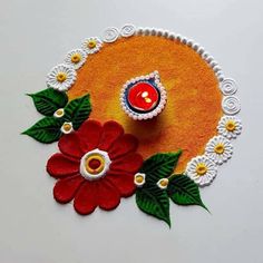 an artistically designed rangolite decoration with flowers