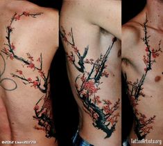 the back of a man's arm with tattoos on it and flowers in blooming branches