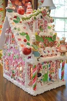 a gingerbread house is decorated with candy and candies