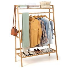 a wooden rack with clothes and shoes on it