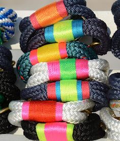 colorful bracelets are stacked on top of each other