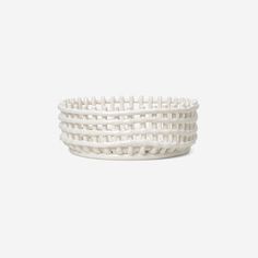 a white woven basket on a white background