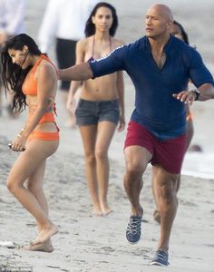 Dwayne Johnson pats bikini-clad beauty on the back on set of Baywatch |   couple tattoos ghost Tattoos Ghost, Beast Workout, Kelly Rohrbach, Biracial Couples, Doors Design, Metal Doors, Boca Raton Florida, Running On The Beach, Fav Celebrities