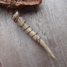 a piece of wood with wire wrapped around it