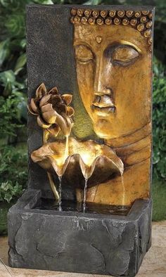 a statue is shown with flowers in it