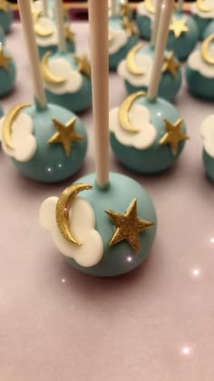 cake pops with stars and moon decorations on them