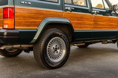 an suv with wood trim parked in a parking lot