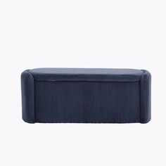 an upholstered blue bench on a white background with no people in the photo