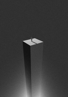 a man standing on top of a tall pillar in the middle of a room with light coming through it